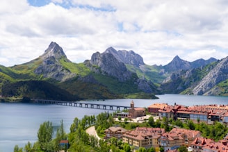 An aerial view of a village and mountains