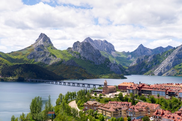 An aerial view of a village and mountains