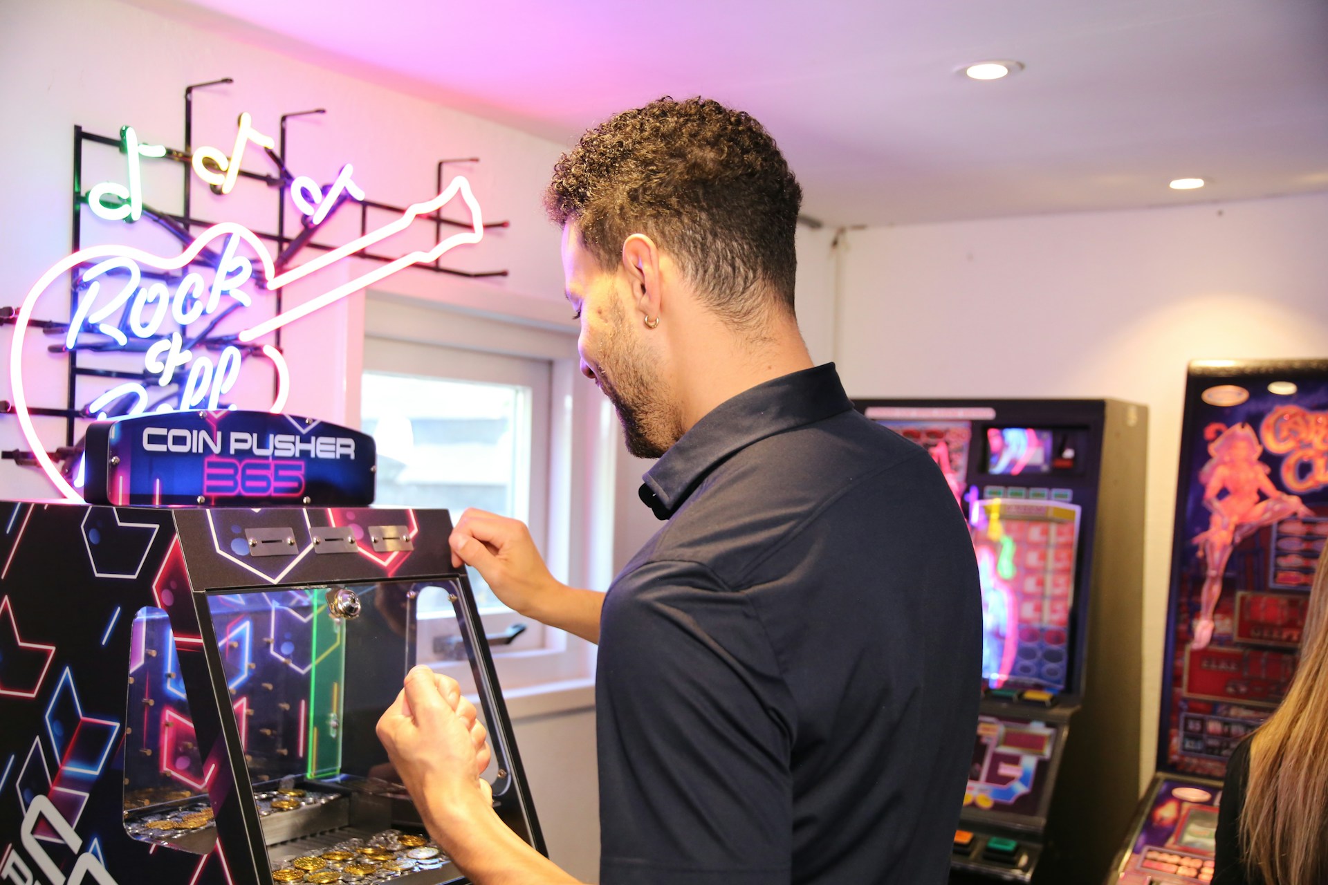 A man is playing a video game in a room