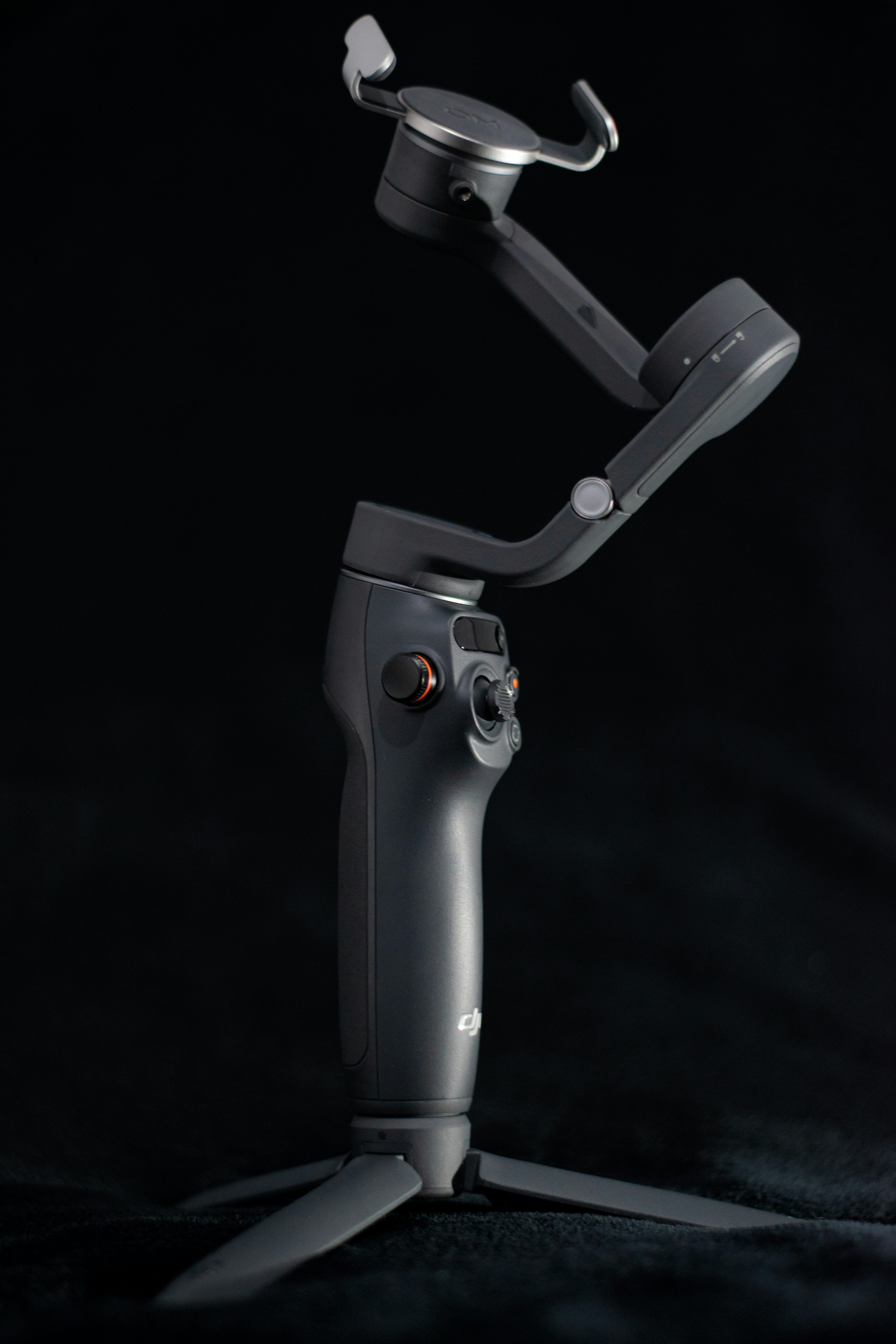 A black and white photo of a camera on a tripod