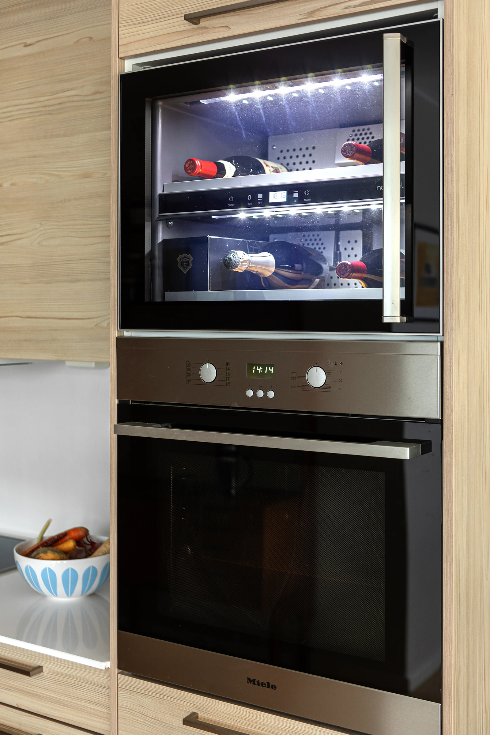 Built-in oven and microwave in bright modern kitchen cabinetry