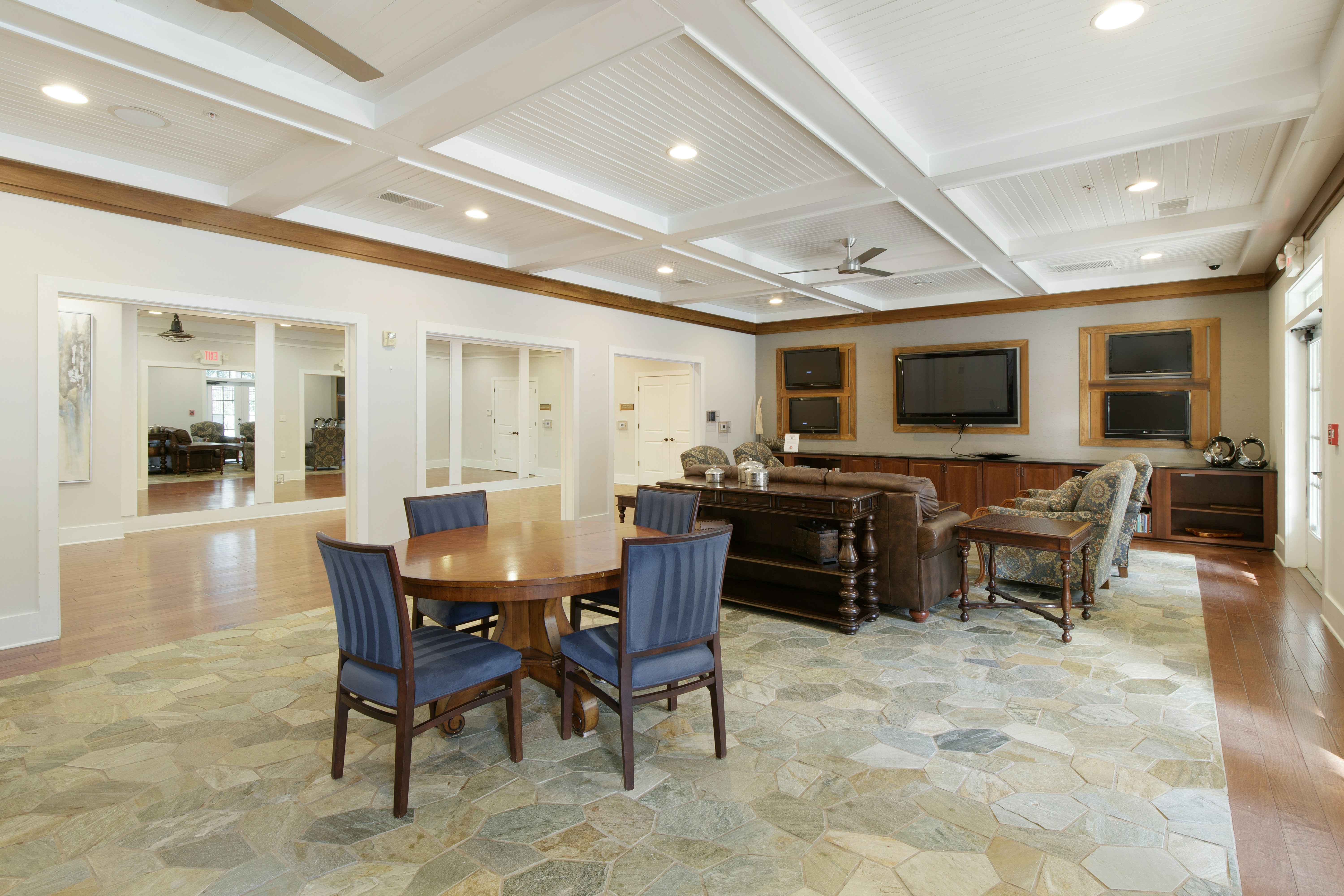 senior community center game room with puzzle tables