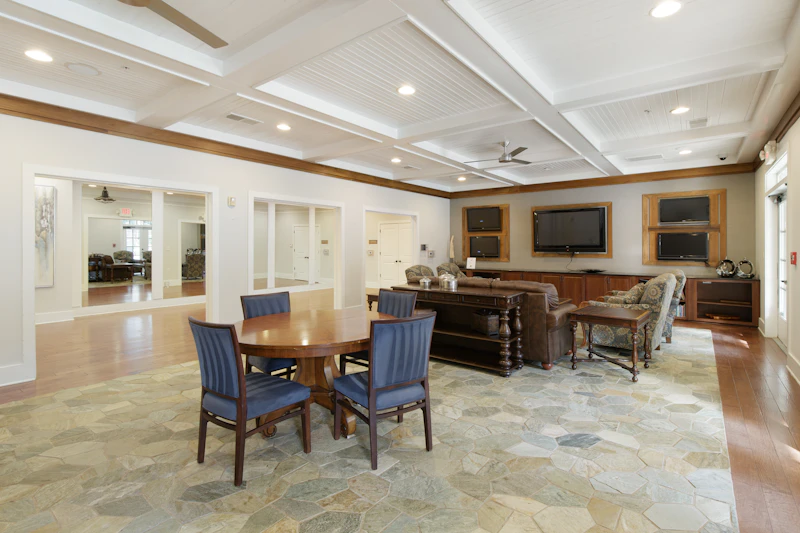 Warm sunlit living room in a home with comfortable senior-friendly furniture