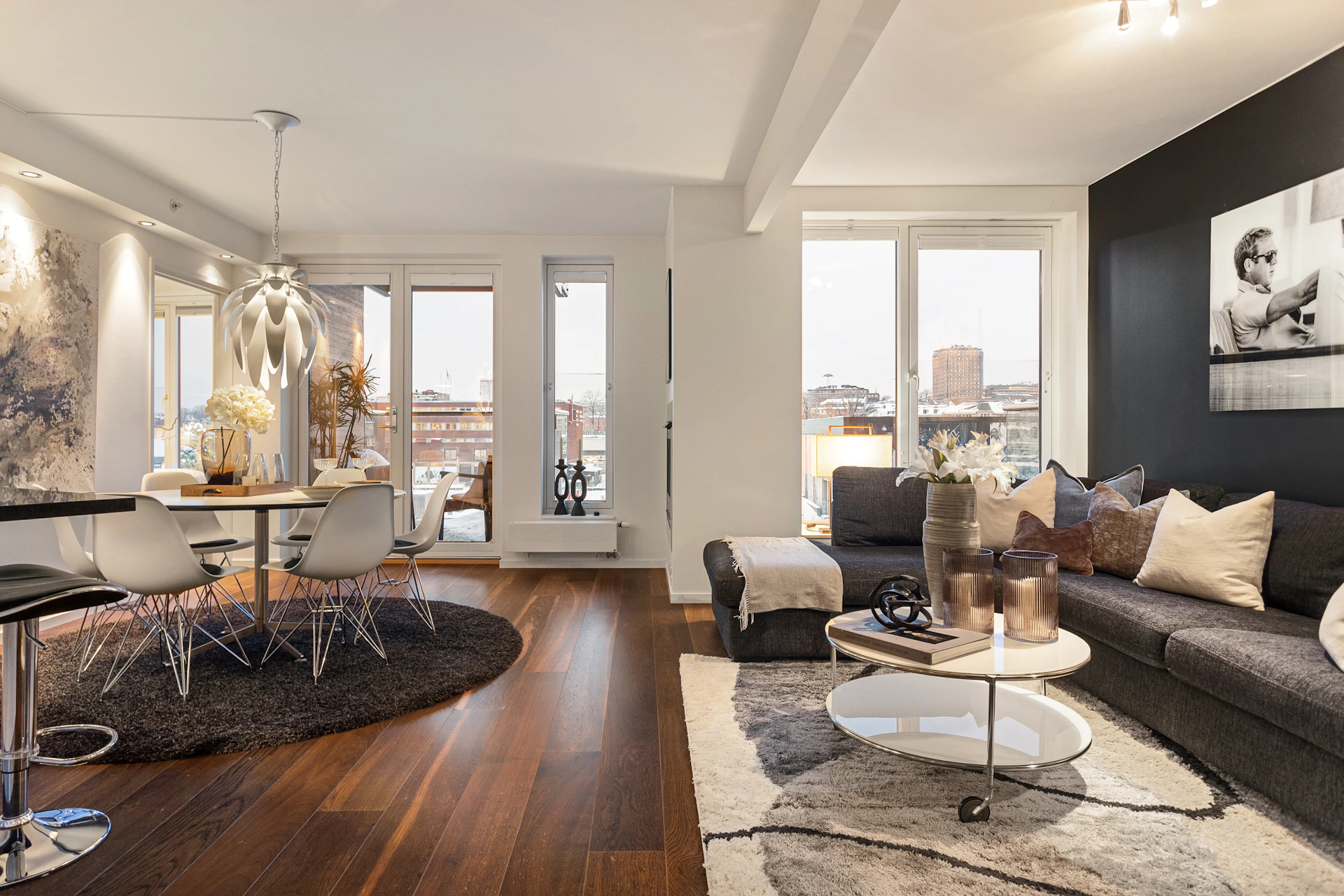 A living room filled with furniture and lots of windows
