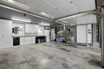 A large room with a lot of white cabinets