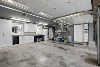A large room with a lot of white cabinets
