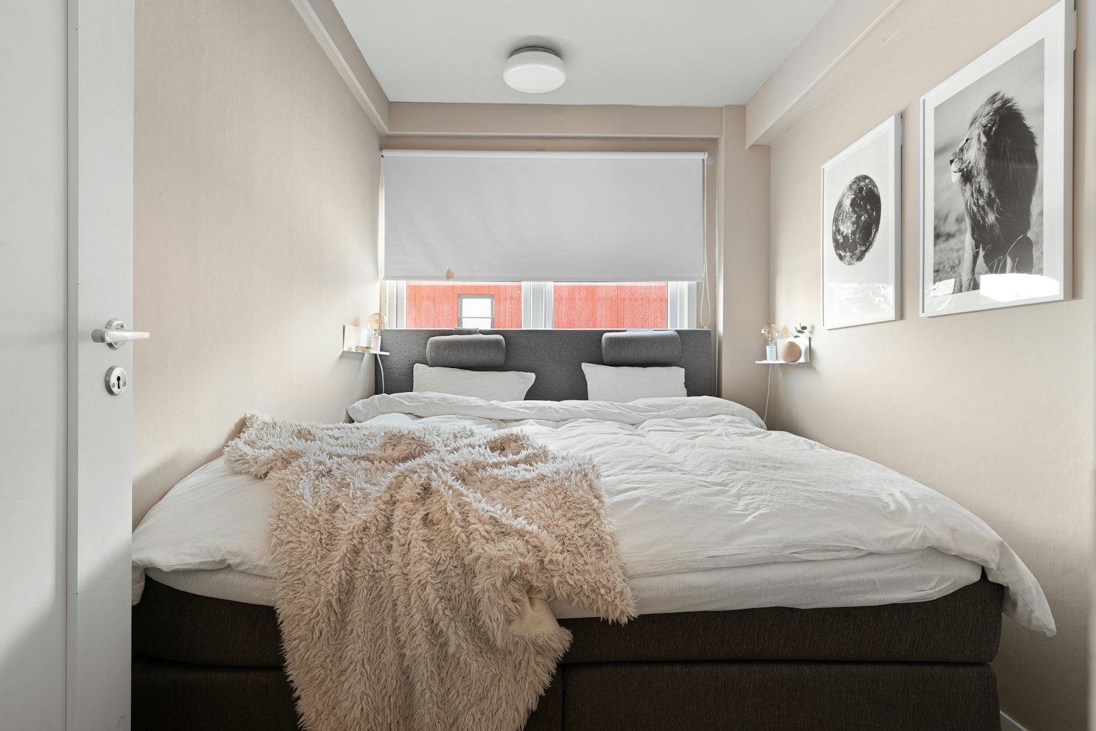 small couples bedroom with double bed and blush walls