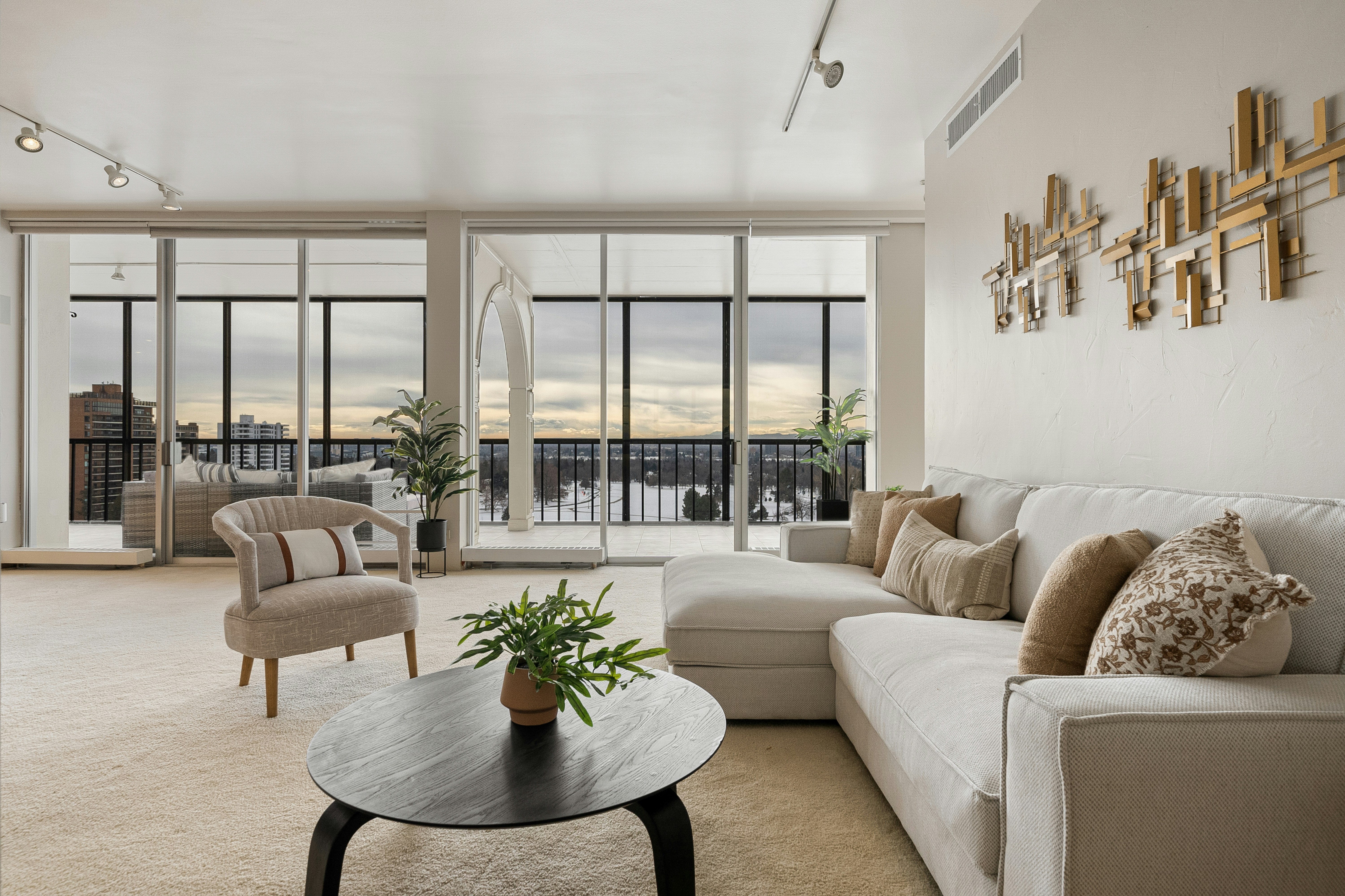 a spacious, modern apartment living room with a view - Resort-style apartment living