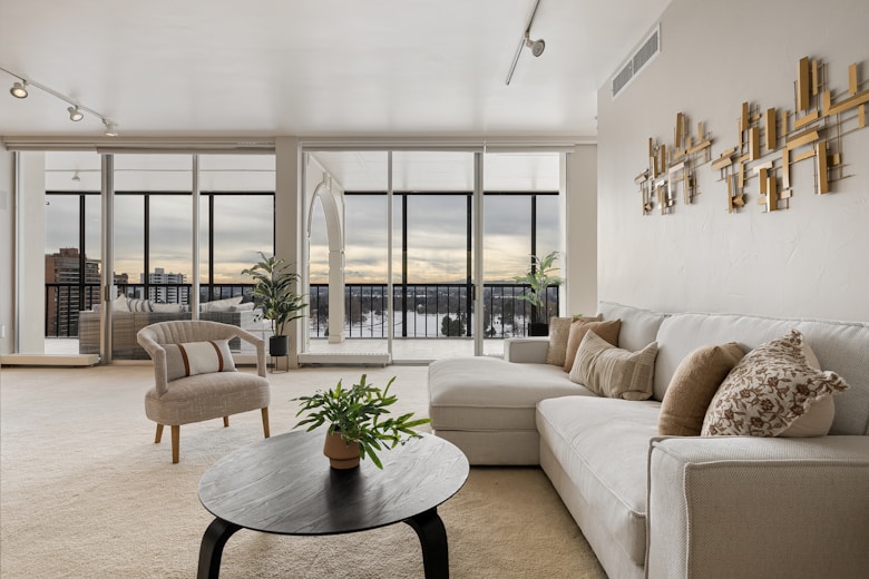 A living room filled with furniture and lots of windows