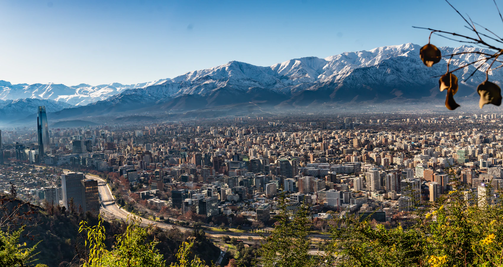 A broad panorama of Santiago with mountains beyond