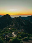 A group of people standing on top of a mountain