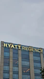 A tall building with a sign on top of it