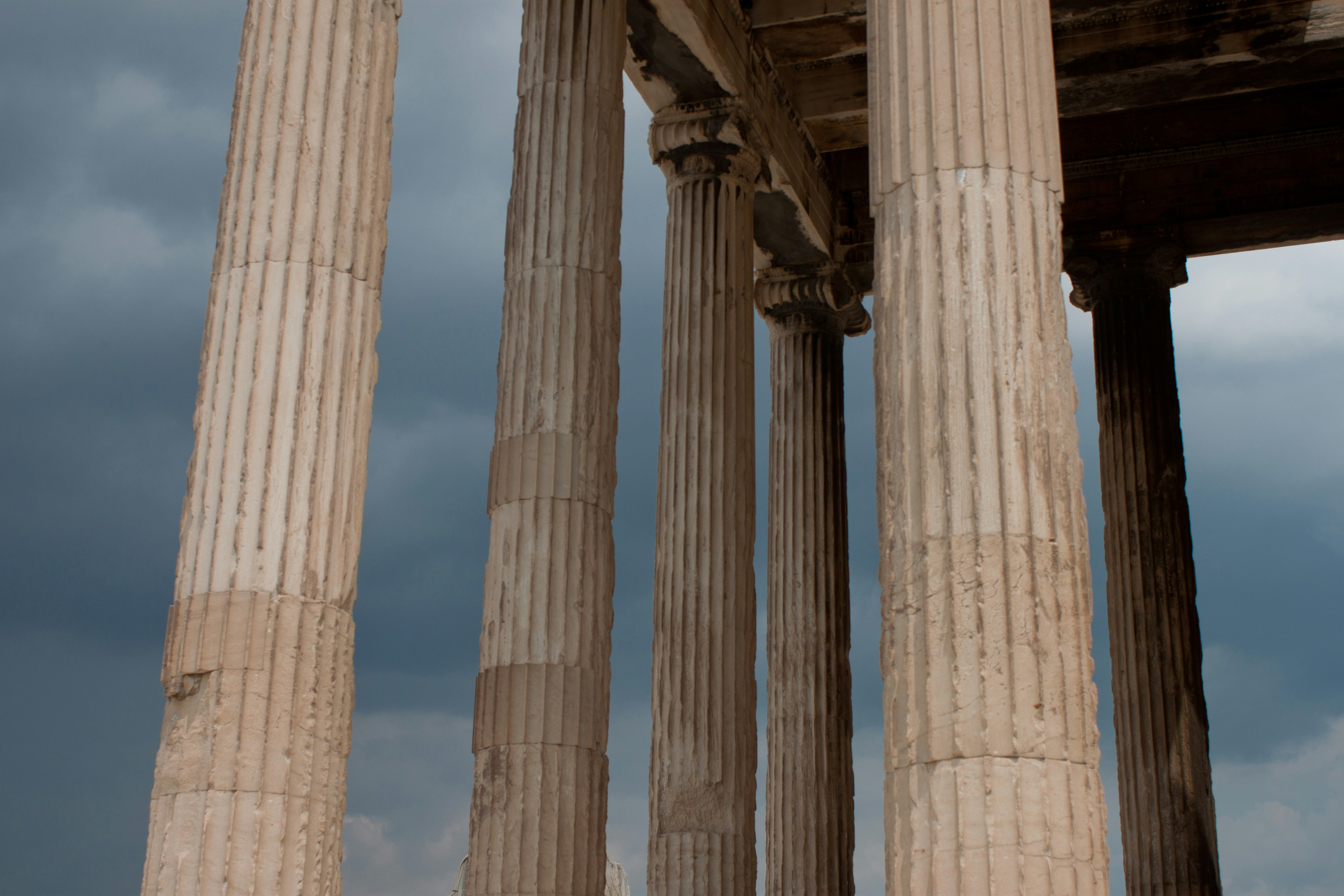 A man standing in front of a row of columns