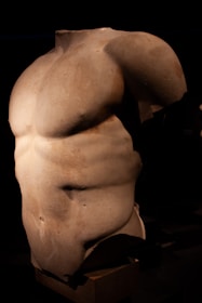 A statue of a man's back with no shirt on