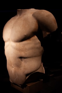 A statue of a man's back with no shirt on
