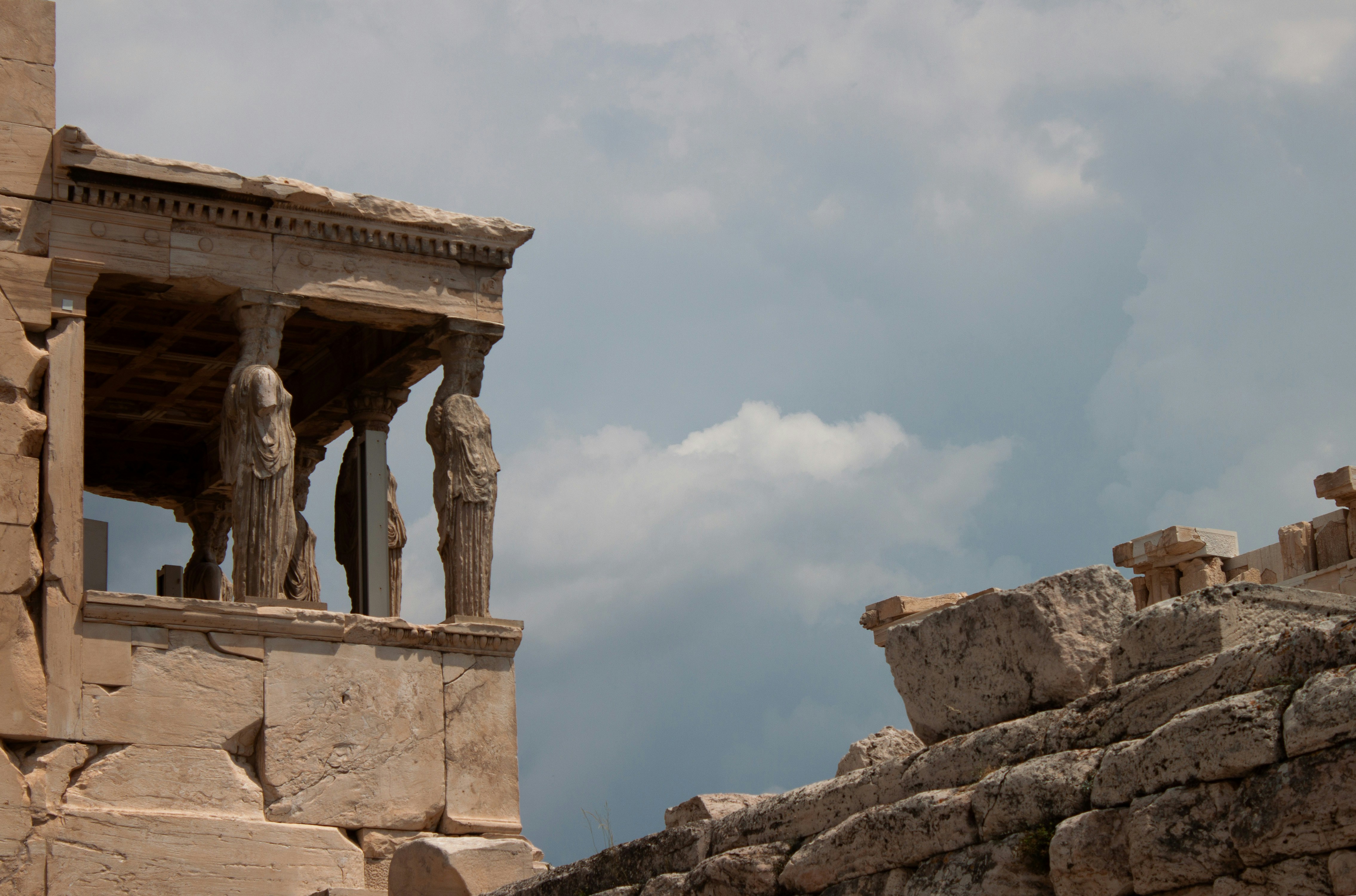 A stone structure with statues on top of it
