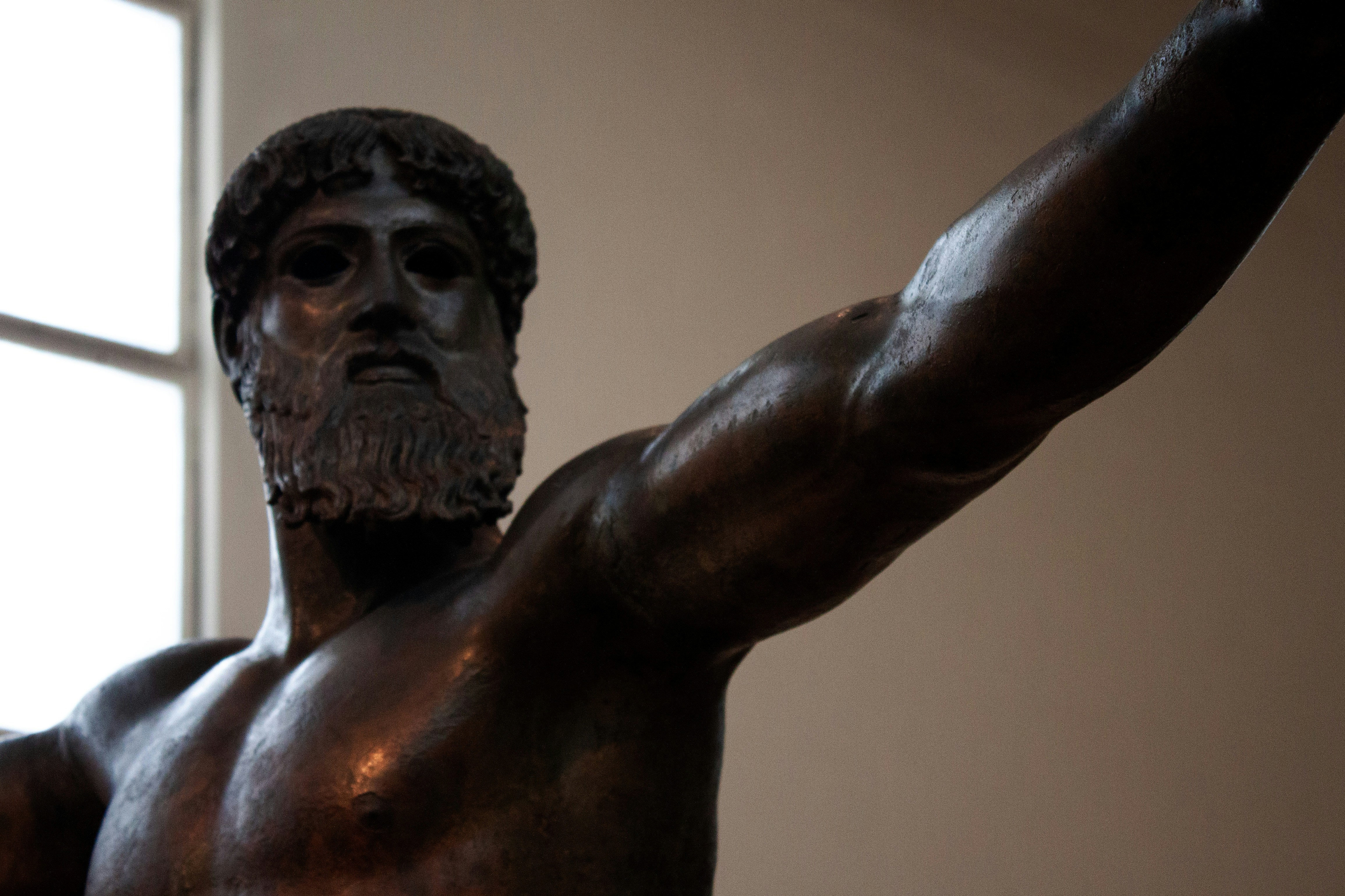 A statue of a man with his arm raised