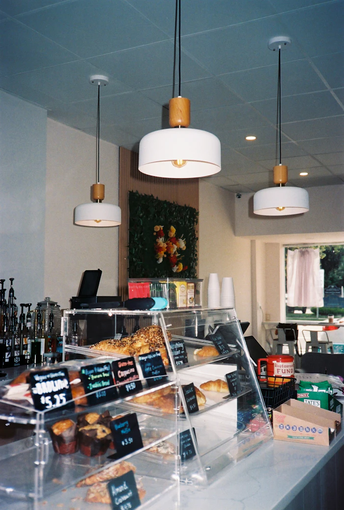 Donuts displayed in a bakery case