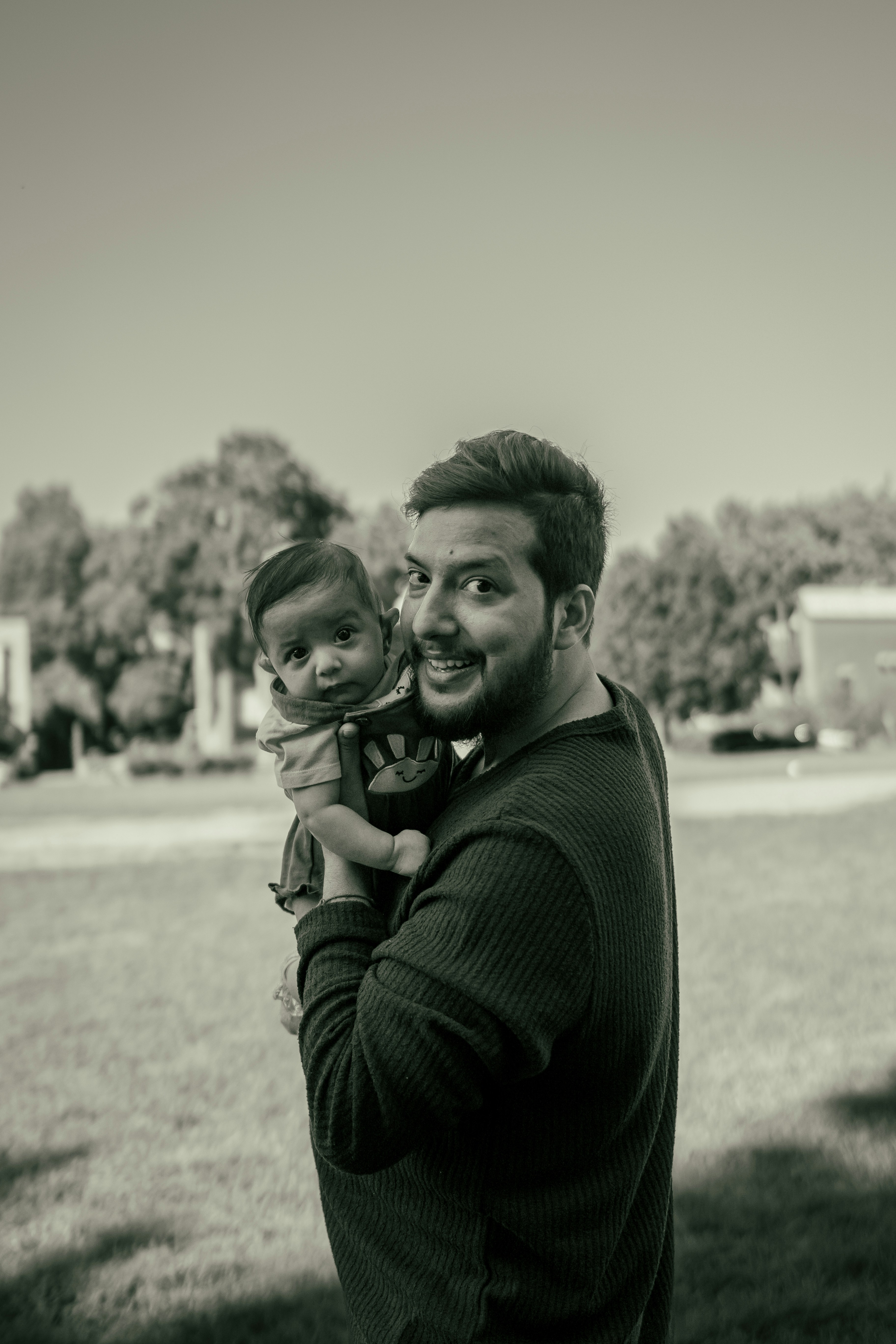 A man holding a small child in his arms