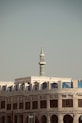A large building with a clock tower in the background