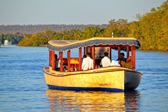 A group of people riding on the back of a boat