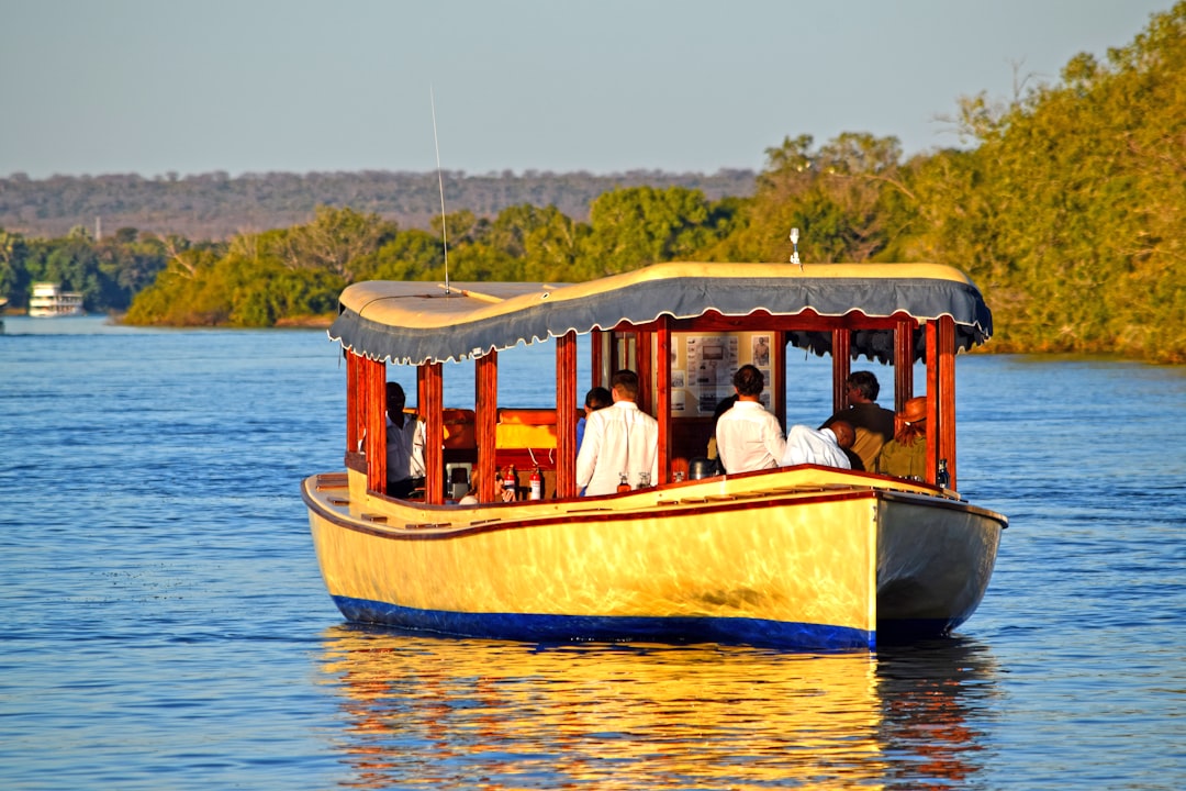 A group of people riding on the back of a boat,