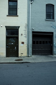 A fire hydrant on the side of a building