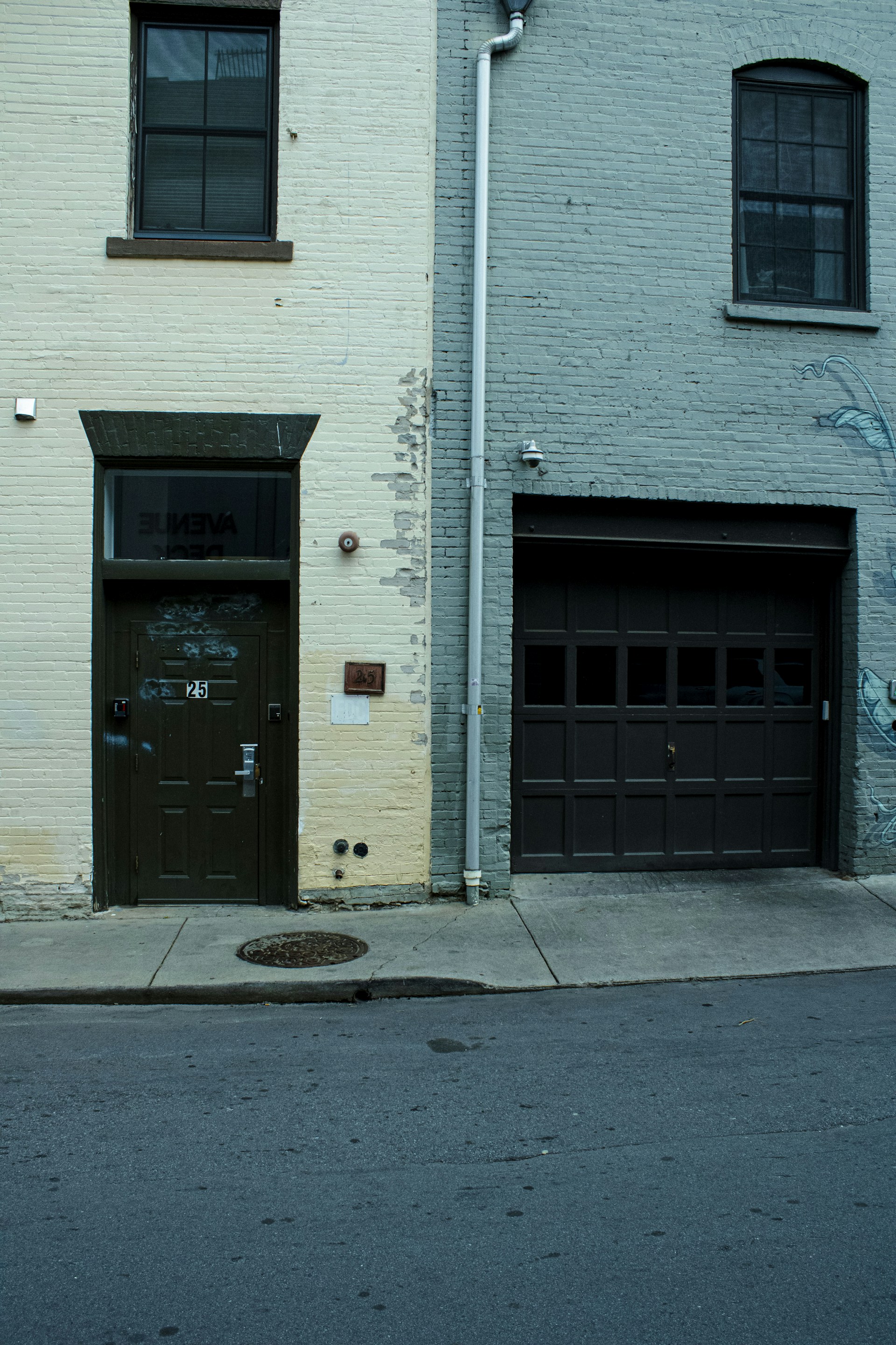 A fire hydrant on the side of a building