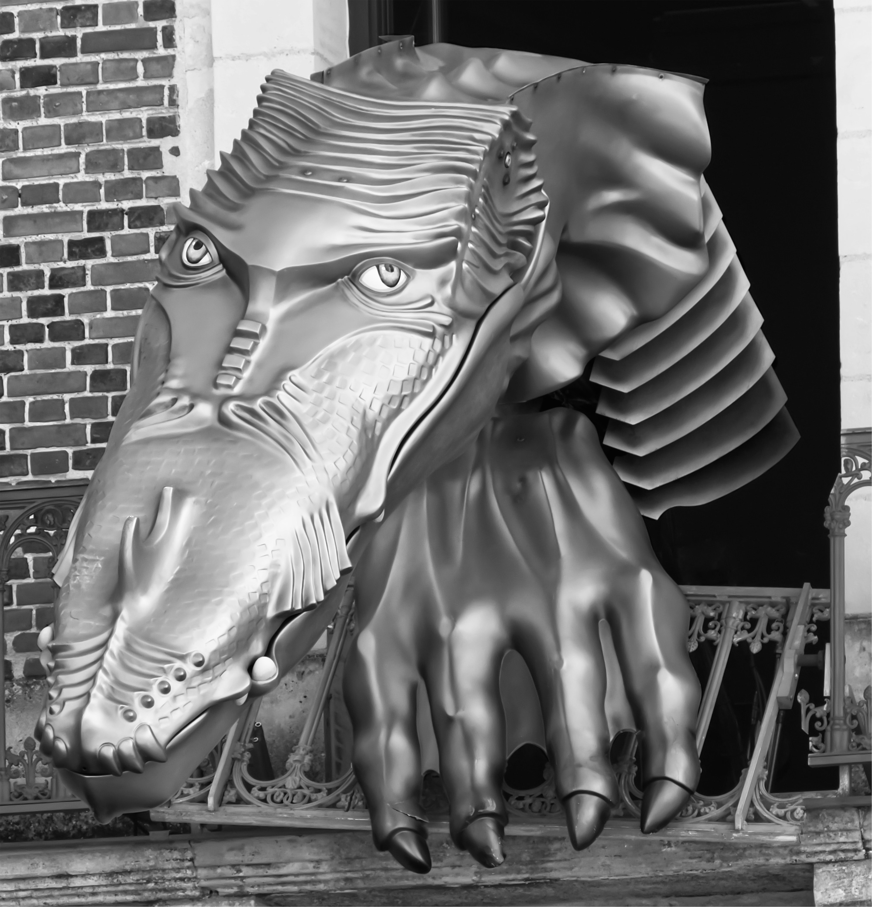 A large metal elephant head on the side of a building