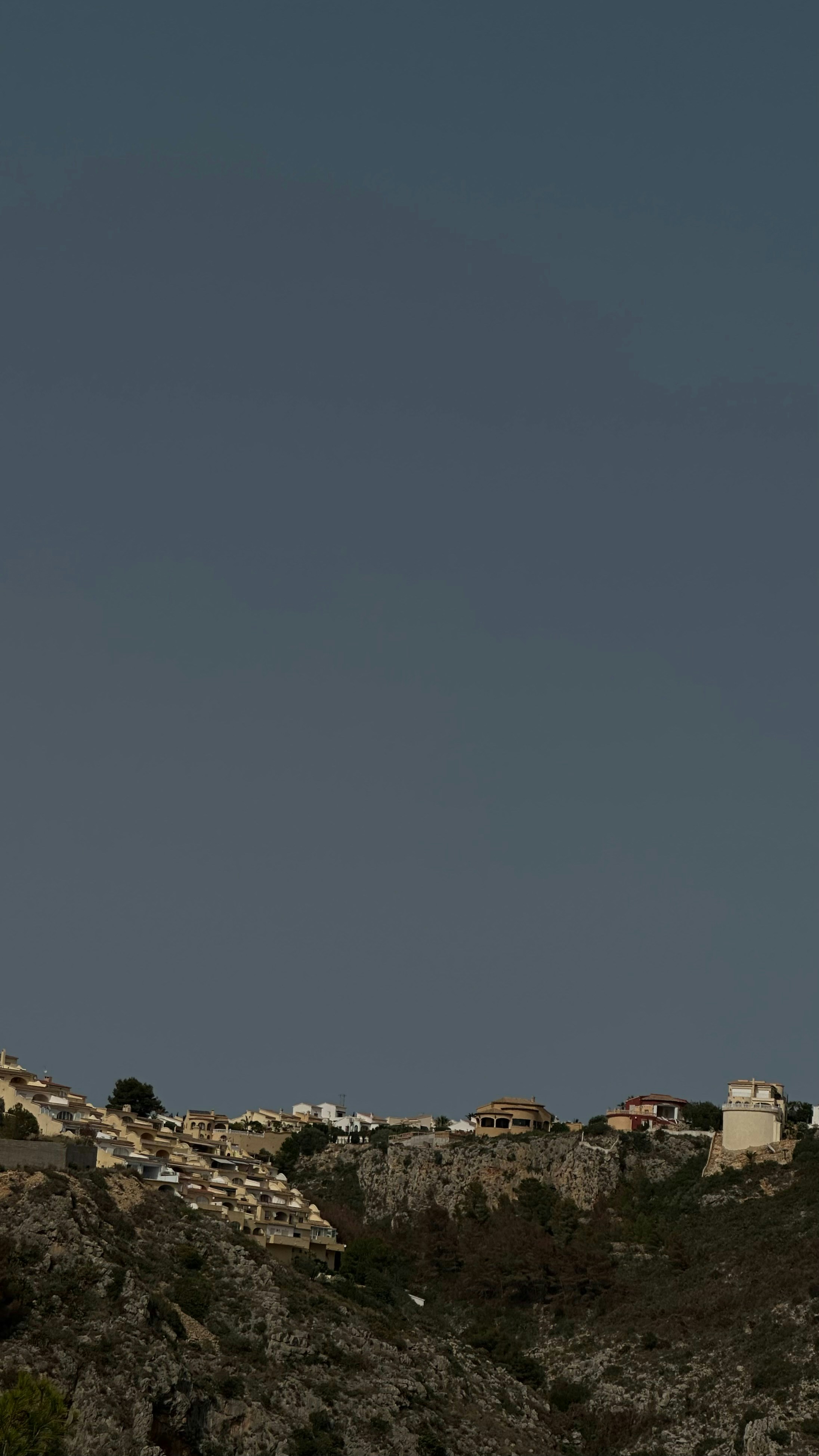 A clock tower on top of a hill