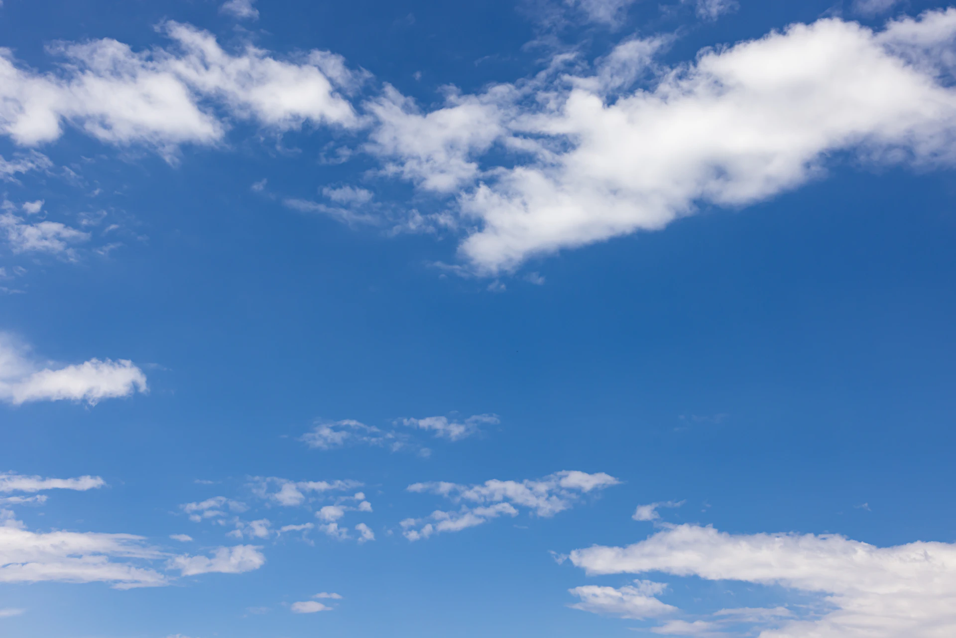 blue sky with scattered white clouds