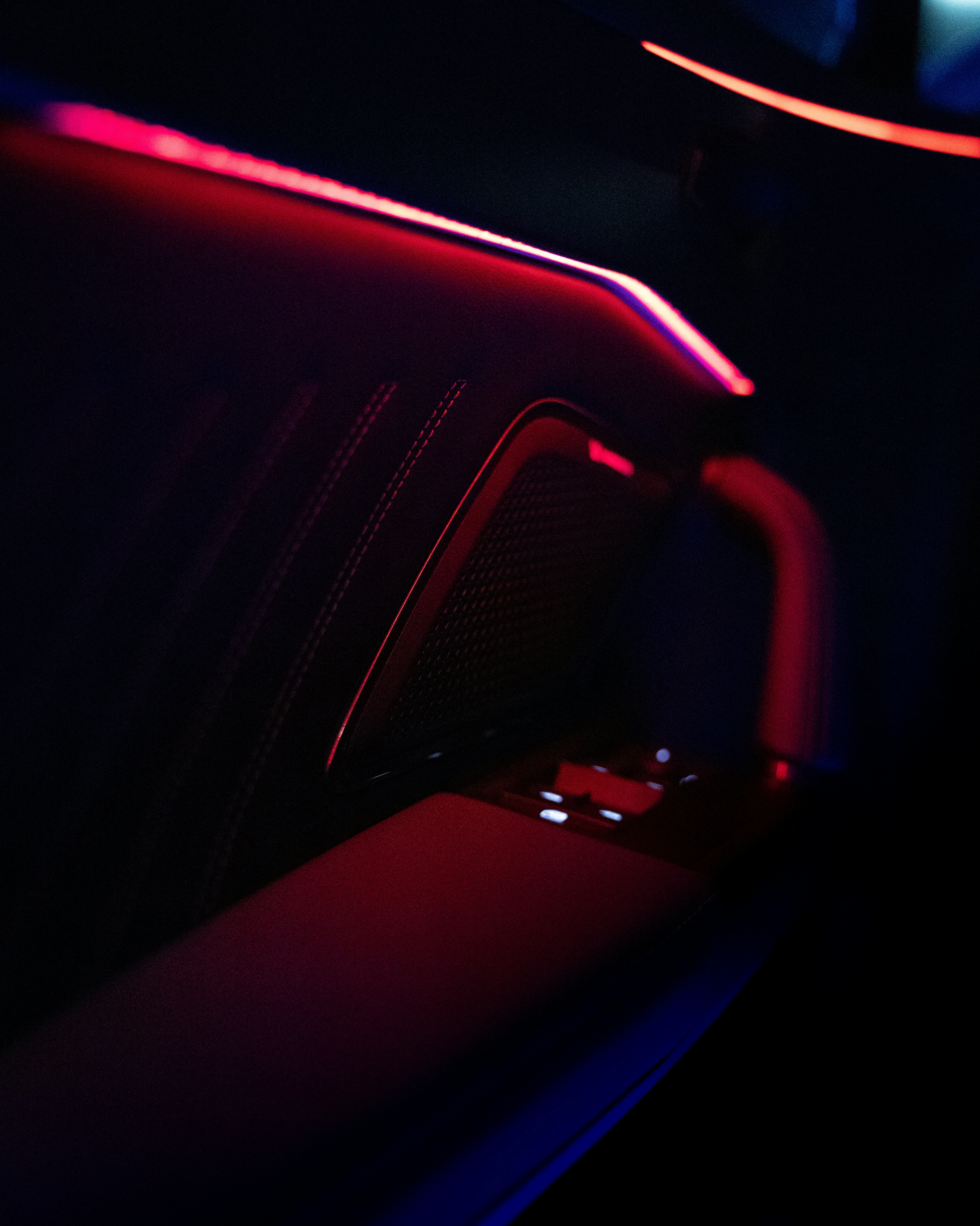 The interior of a car with a red and blue light