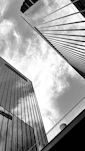 A black and white photo of tall buildings