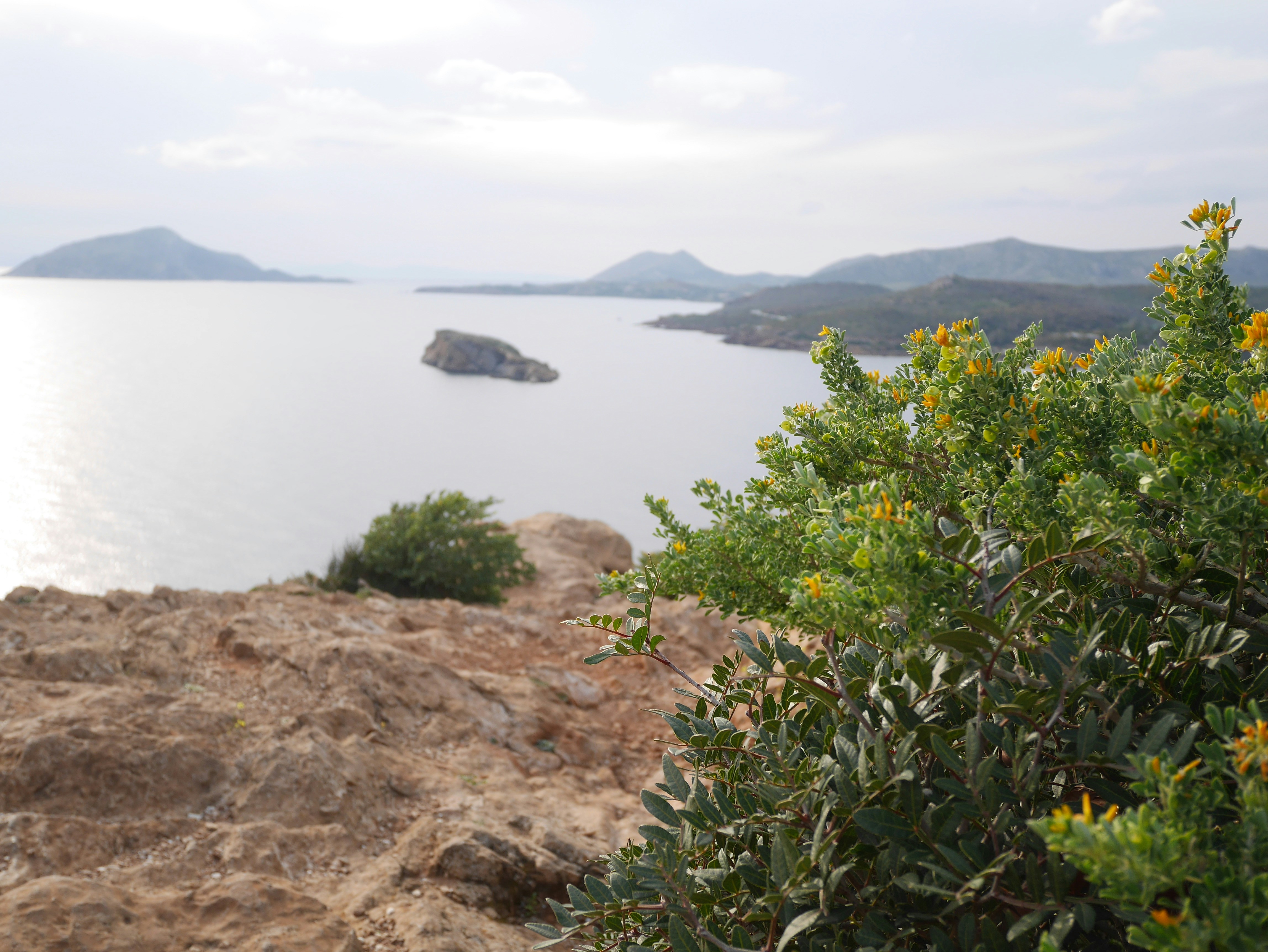 A view of a body of water with mountains in the background