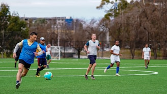 A group of men playing a game of soccer