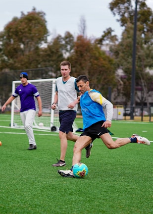 A group of young men playing a game of soccer