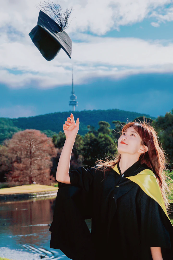 Graduate throwing her cap in Canberra, Australia — post-study work visa age limit