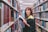 A woman in a library holding a book