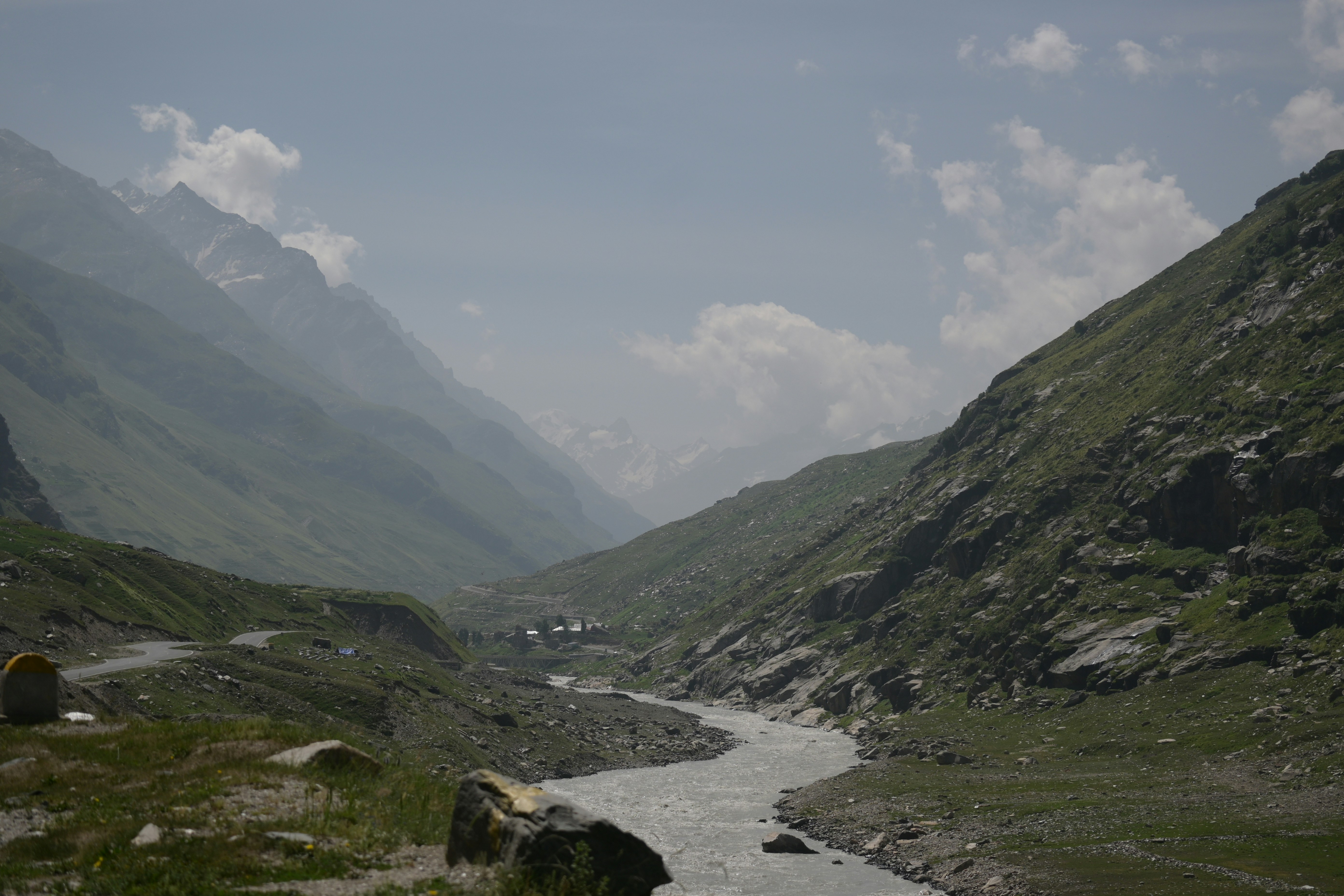 A river running through a valley surrounded by mountains
