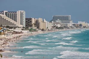 A beach with a bunch of people on it