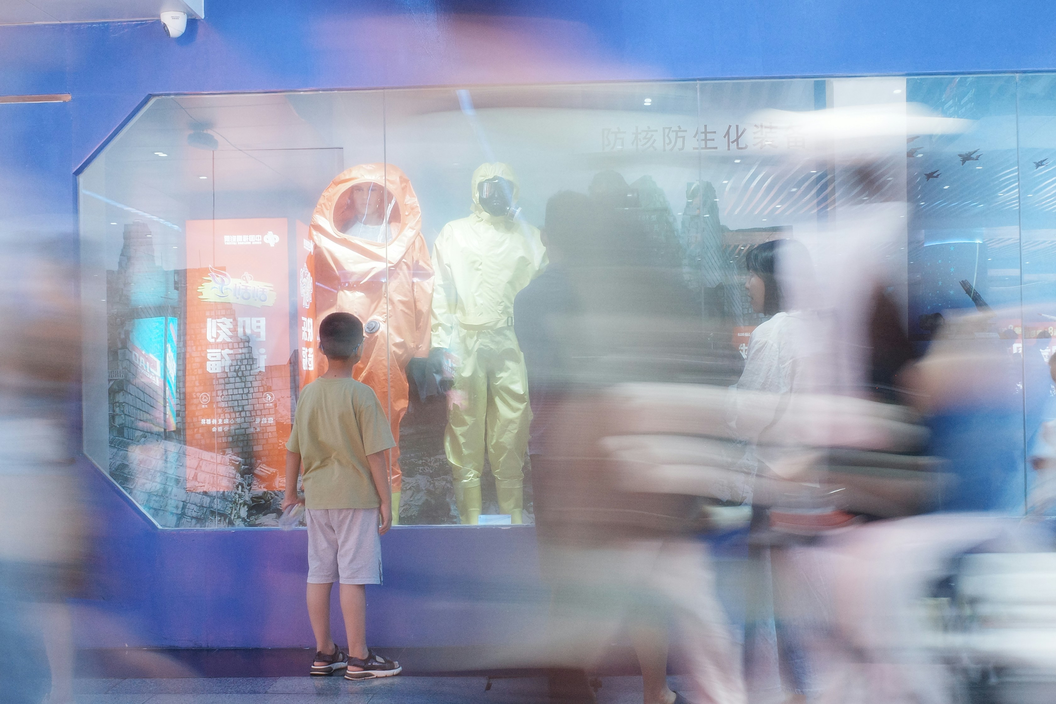 A blurry photo of people standing in front of a store