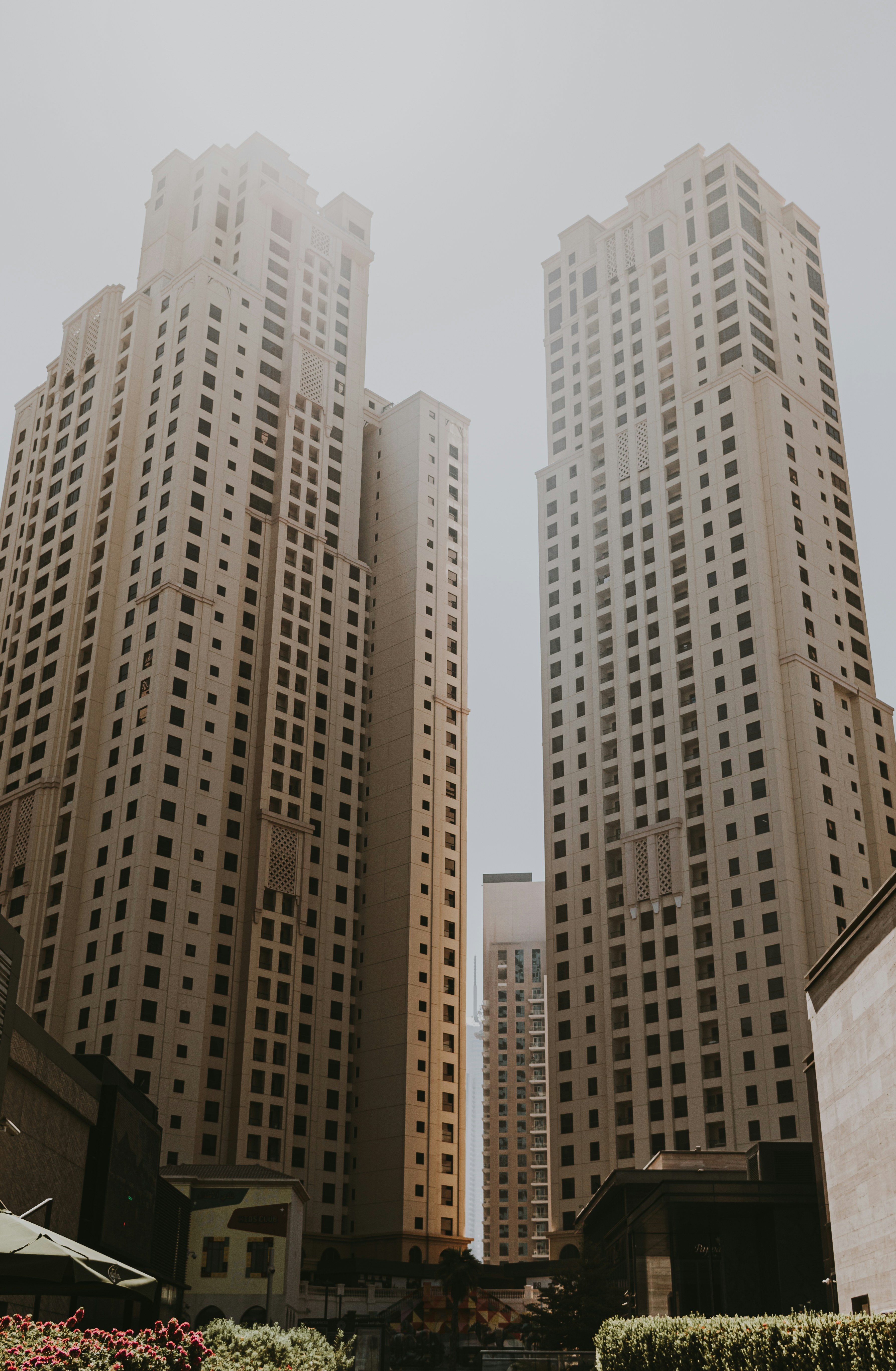 A couple of tall buildings sitting next to each other