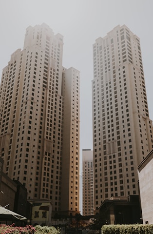 A couple of tall buildings sitting next to each other