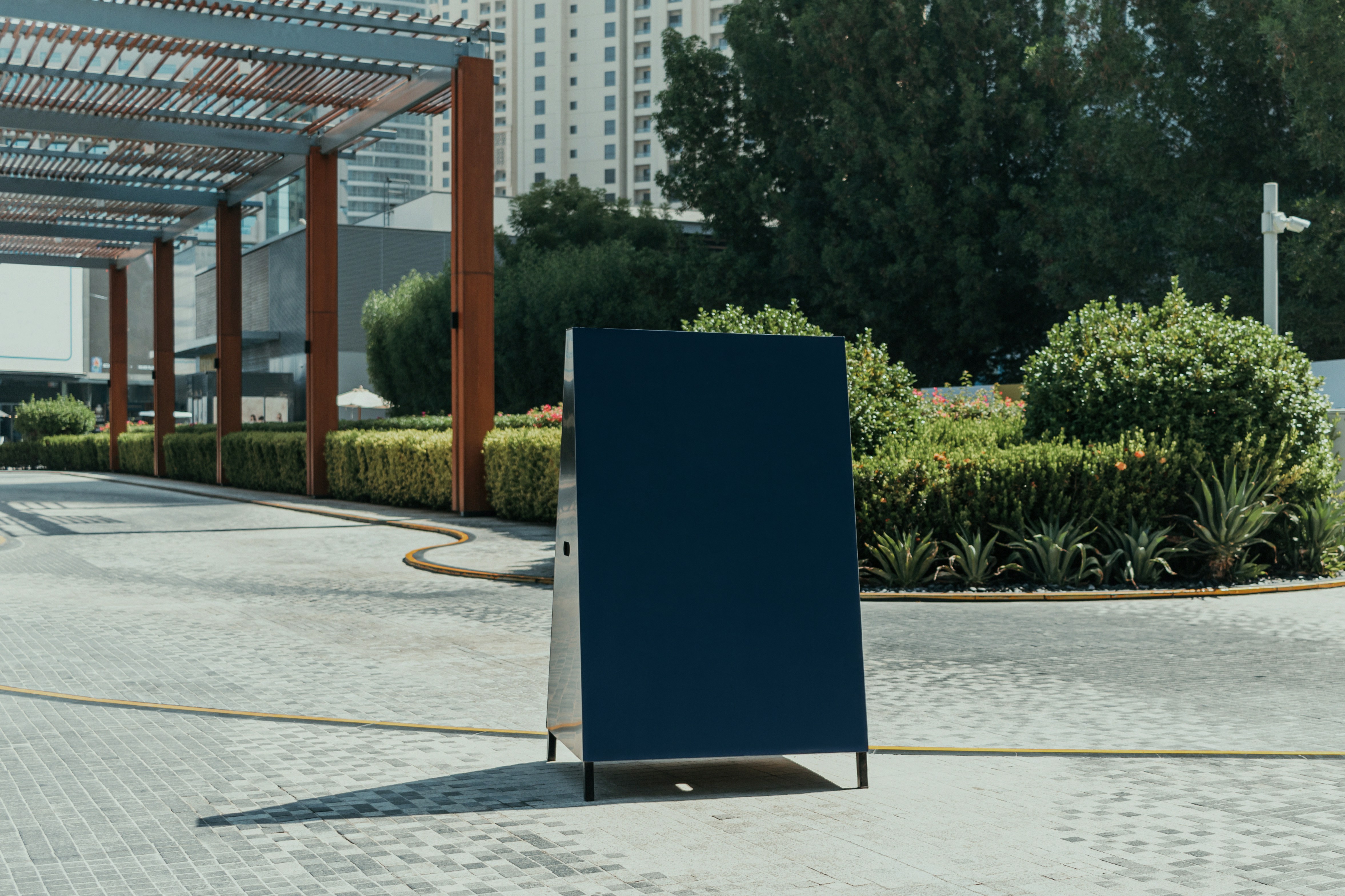 A blue sign sitting on the side of a road