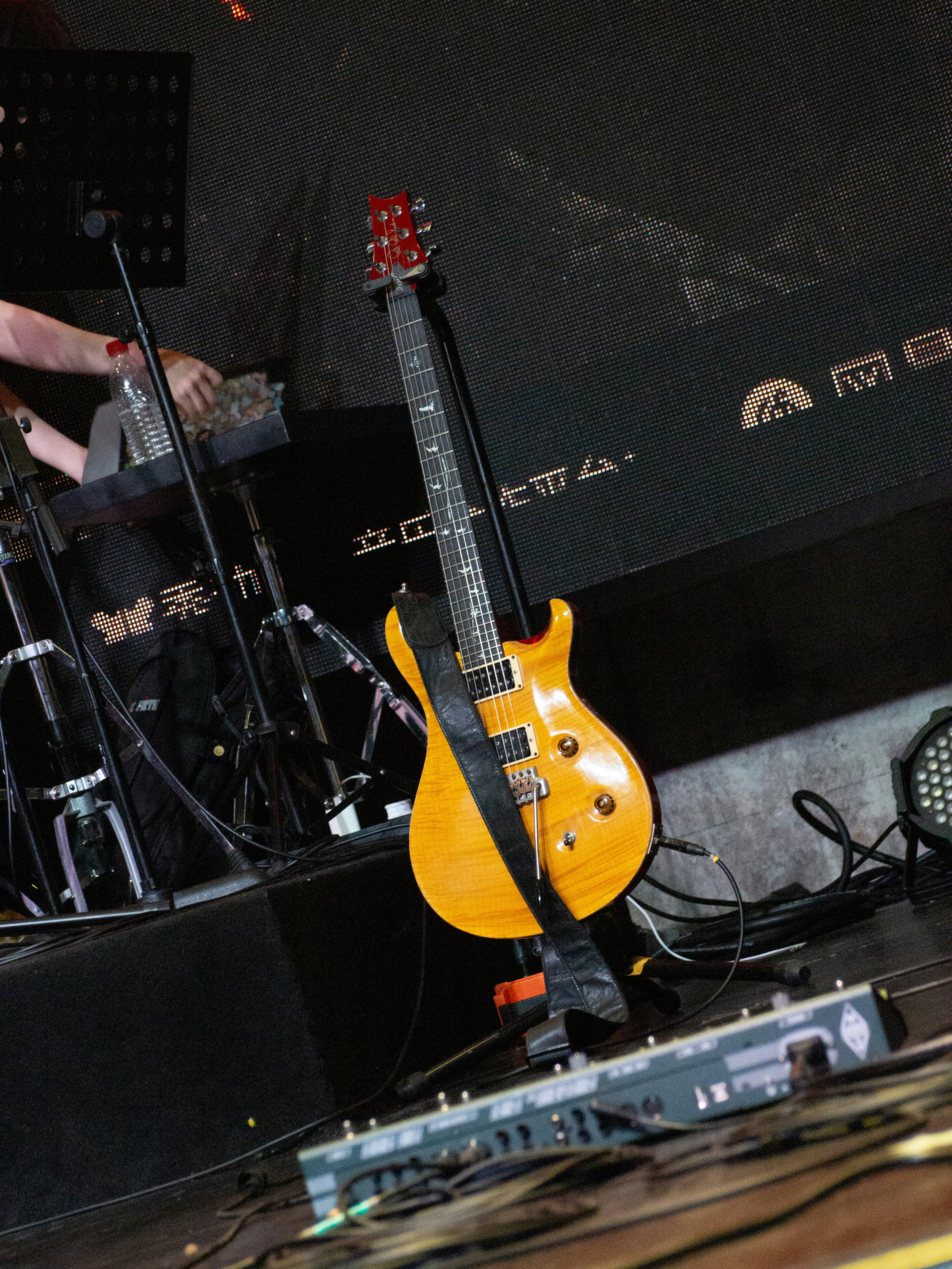 A yellow guitar sitting on top of a table