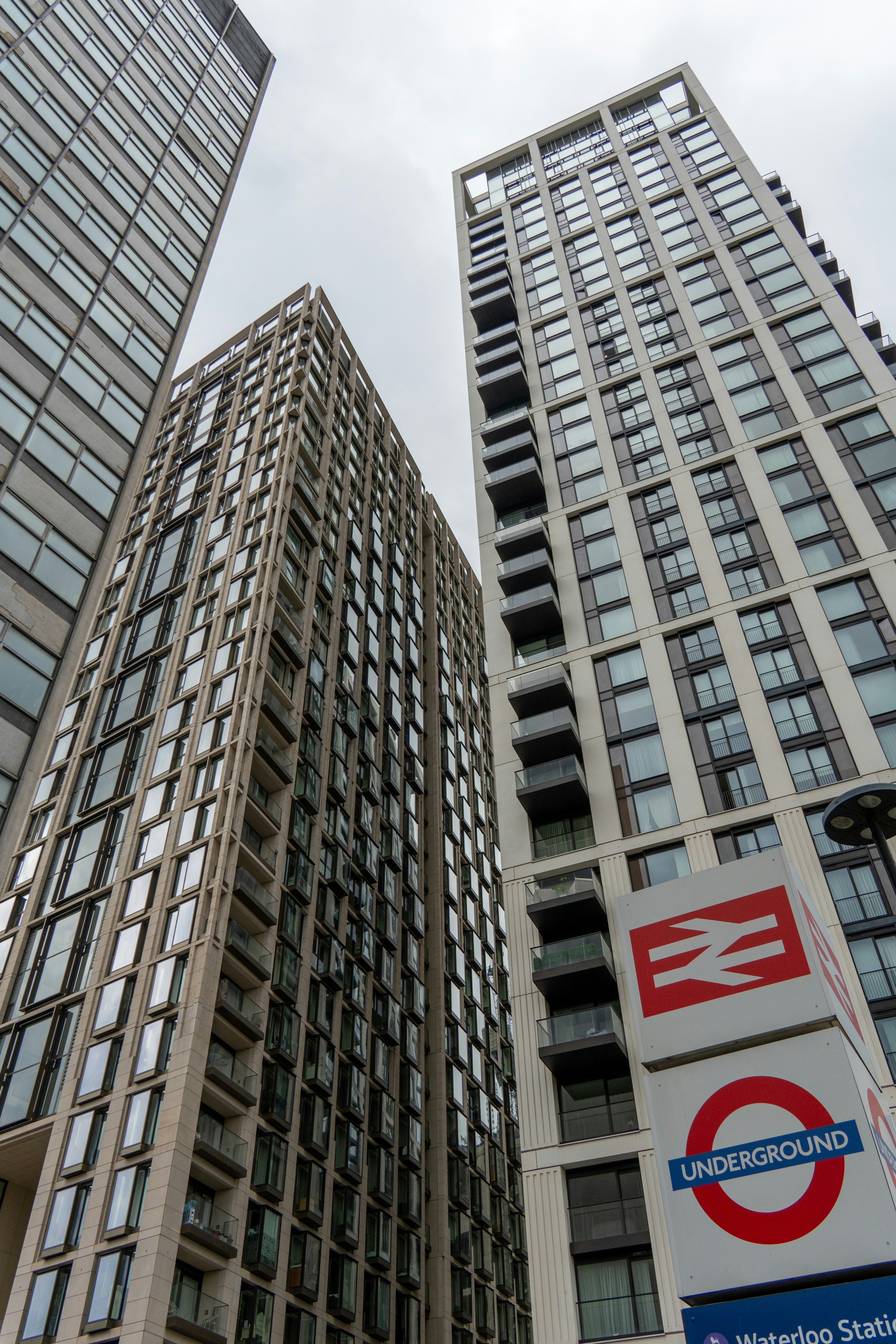 A couple of tall buildings sitting next to each other