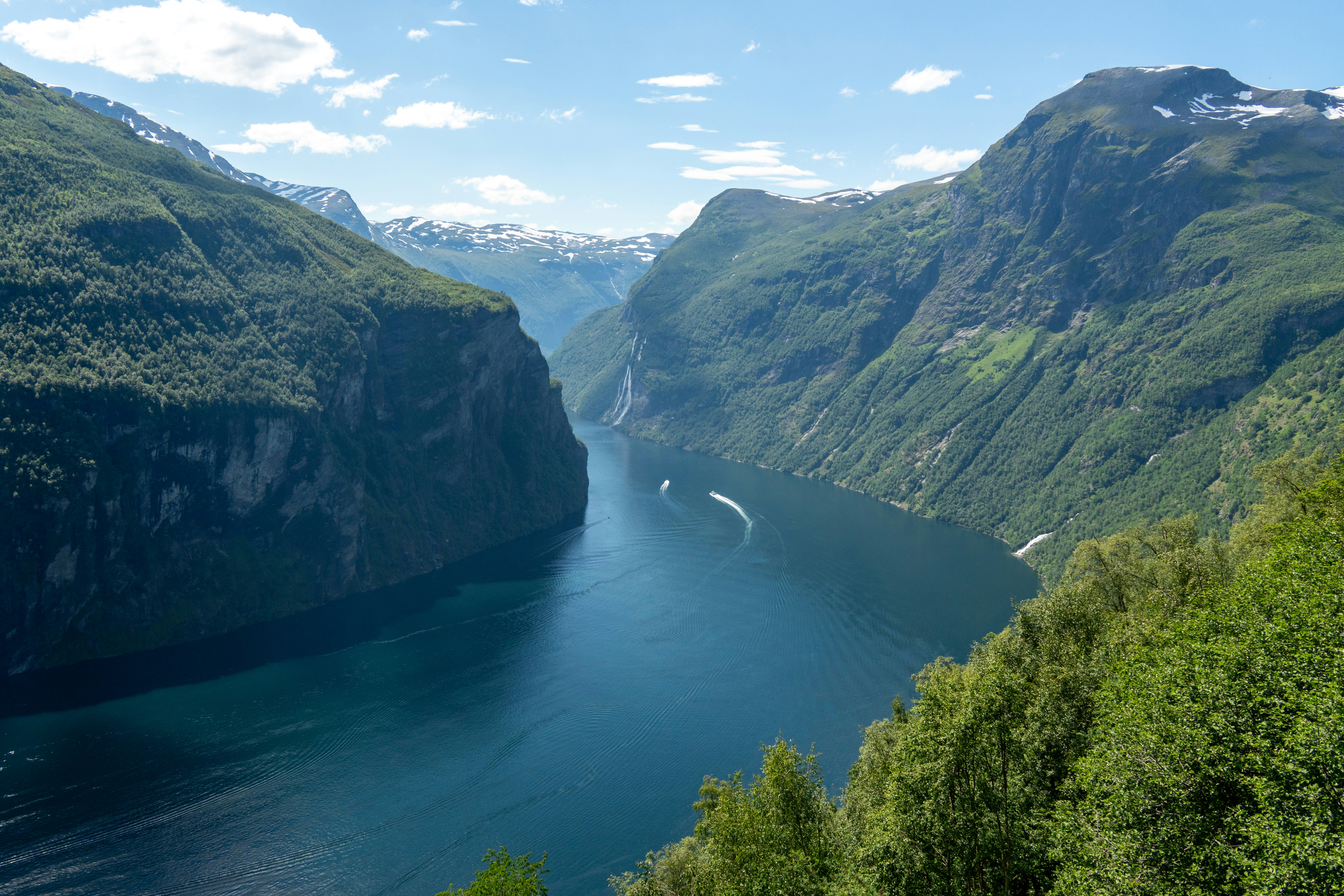 A scenic view of a river surrounded by mountains