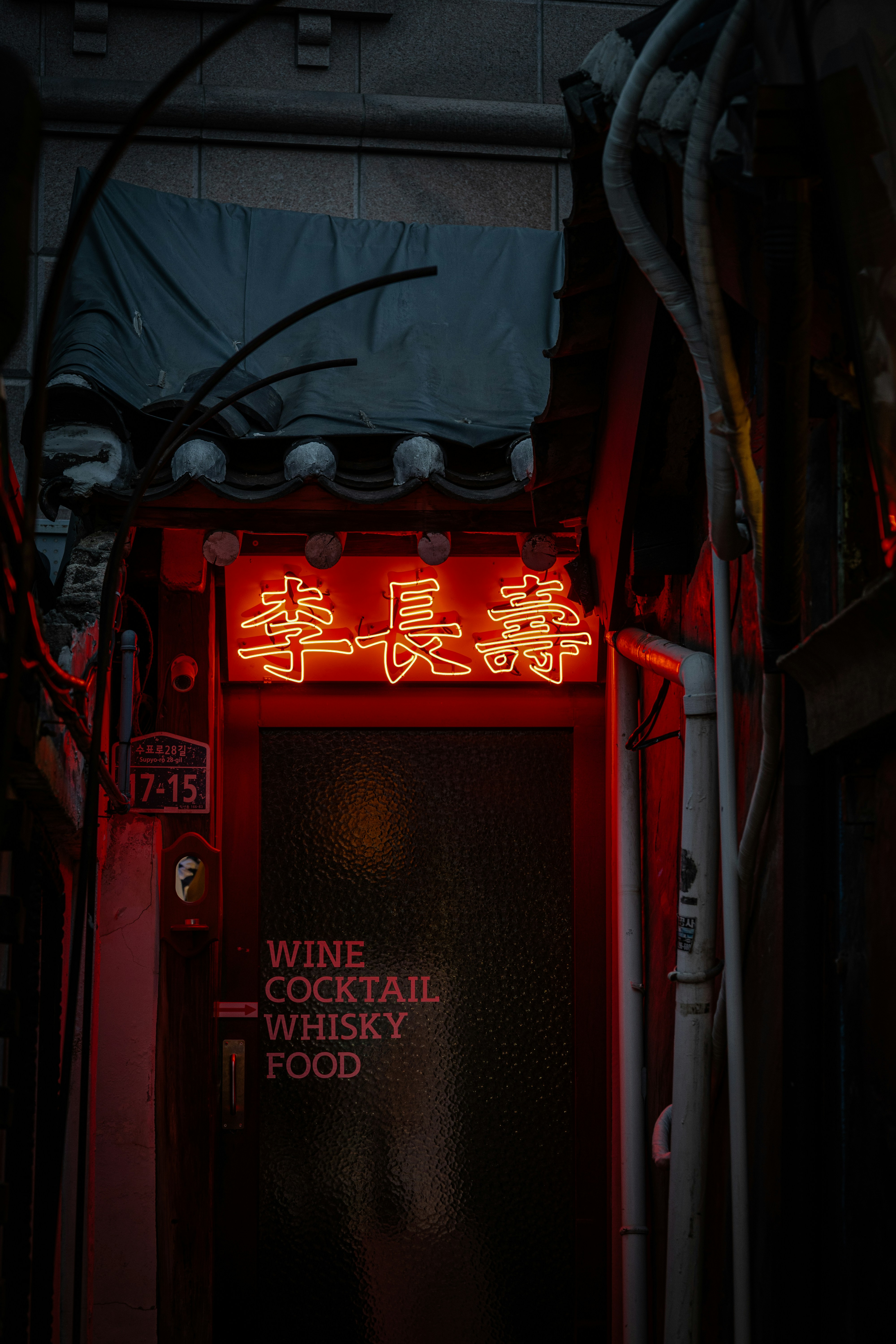 A red light that is on the side of a building