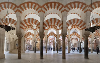 A large room with many pillars and arches