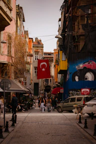A city street filled with lots of cars and people